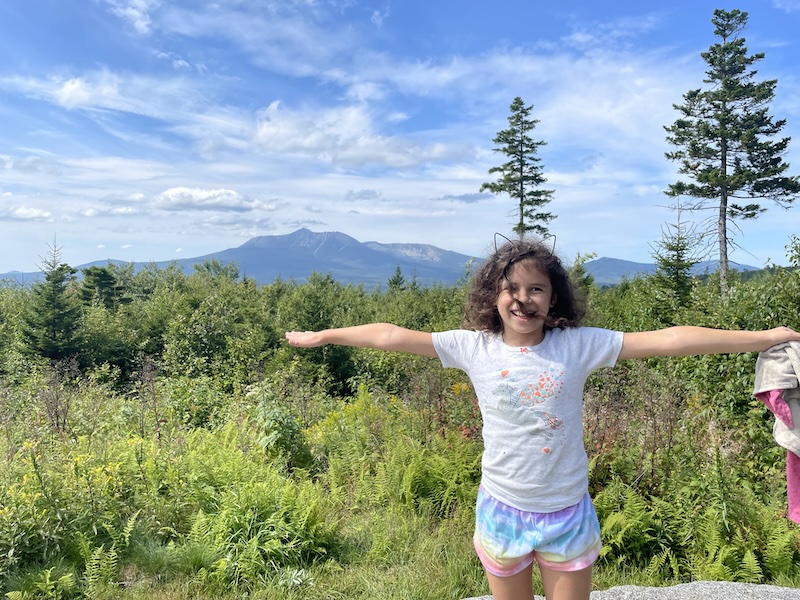 My daughter in front of Mount Katahdin.